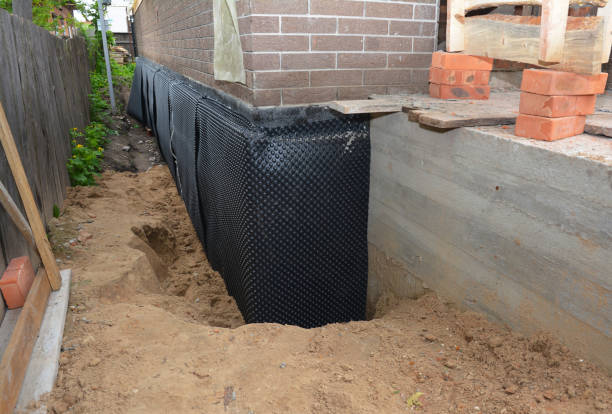 Happy homeowners after waterproofing job in Hartford